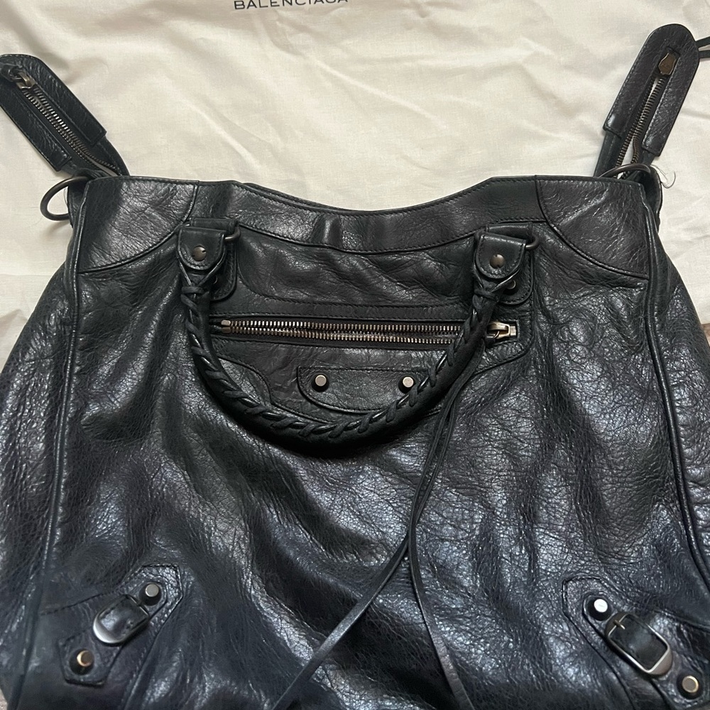 Balenciaga… good size bag.. can be used as crossbody. Faded black serious buyers